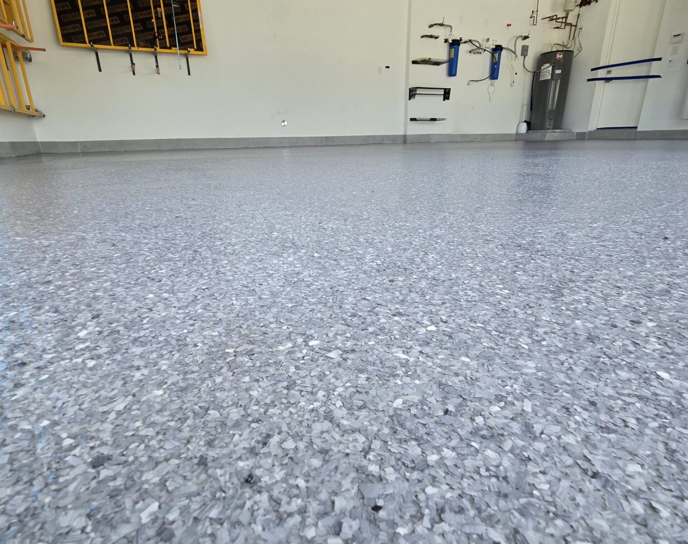 Sleek and durable epoxy garage floor installed by Carbon Concrete Coatings in Aventura home